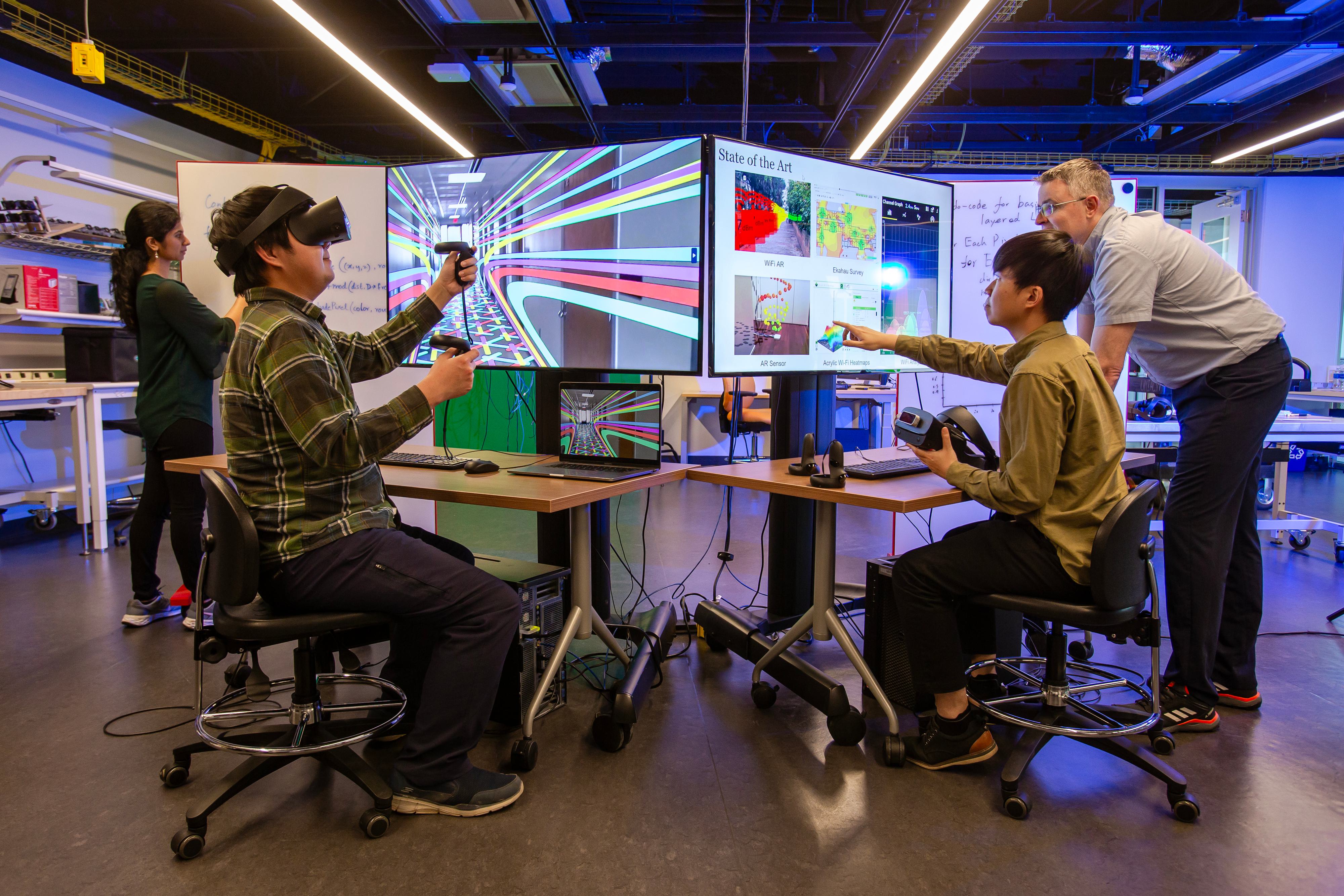 Students work on research projects with a faculty member