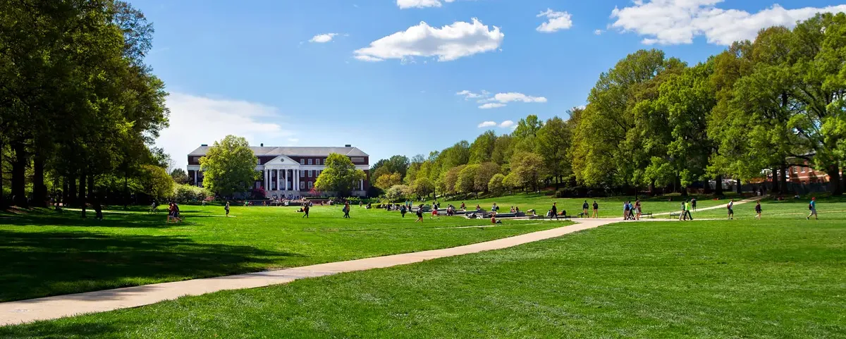 Students walking through Mckeldin Mall on a partly cloudy day
