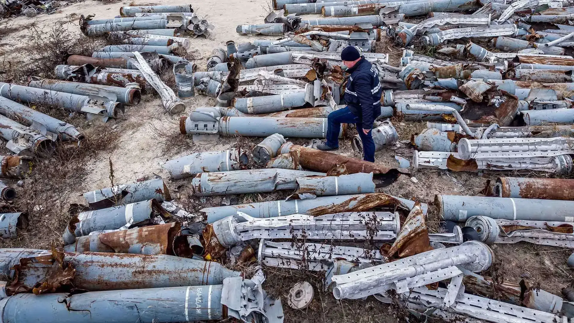 A Ukrainian expert examines the collected remnants of shells and missiles used by the Russian army in Kharkiv.