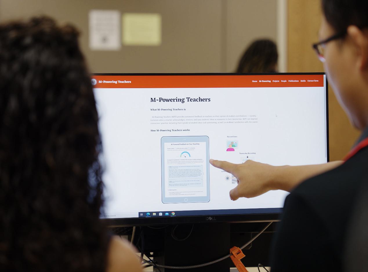 2 people looking at a computer screen