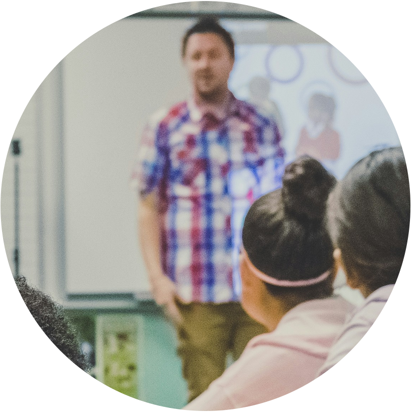 teacher standing in front of a classroom